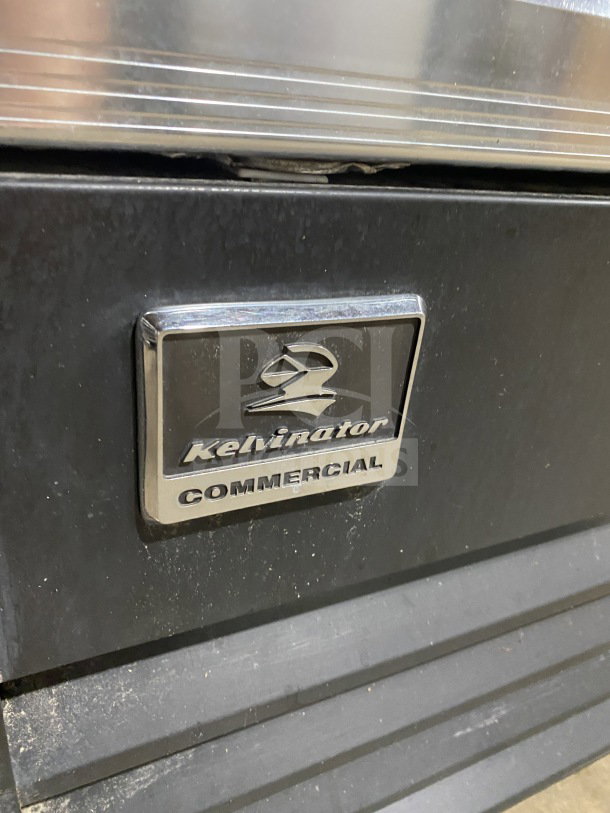 Kelvinator Commercial 28" Display Freezer, Model KCGM24FB, with swinging door, bottom compressor, on casters.