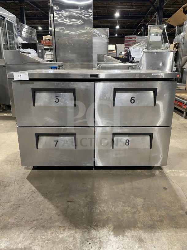 True TUC-48F-D-4-HC undercounter freezer, stainless steel, 4 drawers, marble worktop, up-turned splash, on casters, 115V 1 phase.