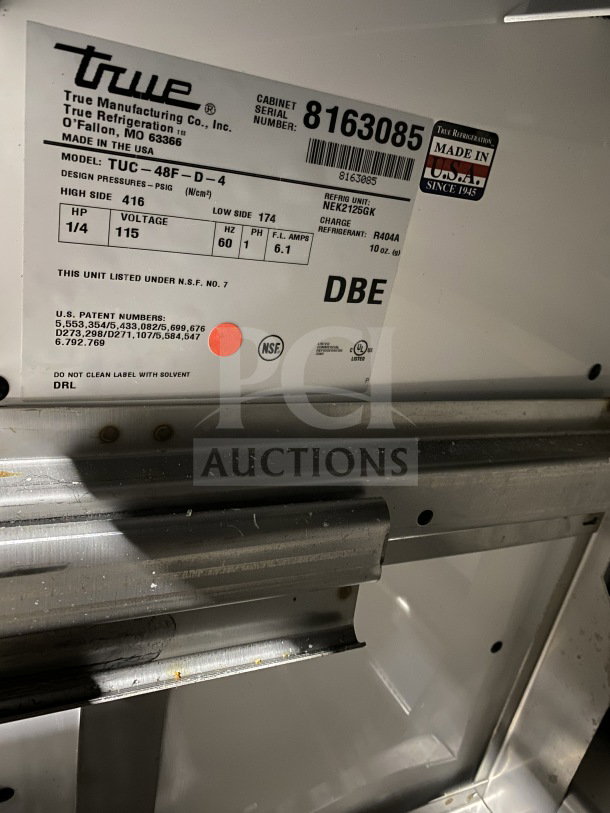 True Commercial Stainless Steel 4 Drawer Undercounter 48" Worktop Freezer, Model TUC48FD4HC, on casters, NSF certified.