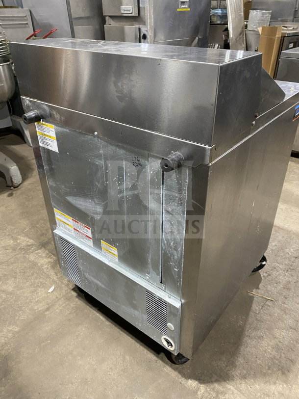 Beverage Air stainless steel refrigerated sandwich prep table, model SPE27HCB, on casters, with single door storage, poly-coated rack.
