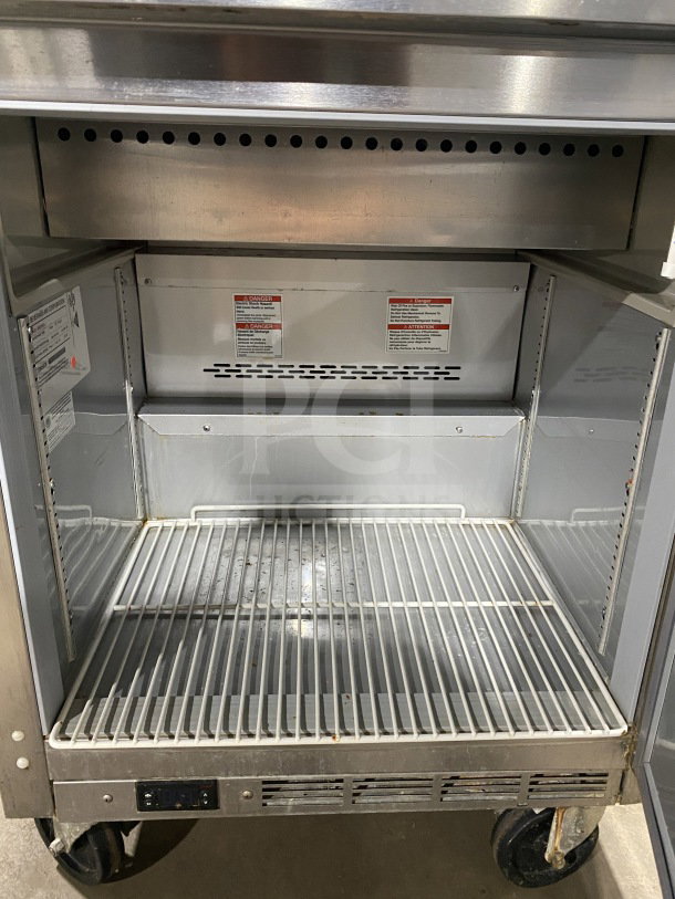 Beverage Air refrigerated sandwich prep table, model SPE27HCB, stainless steel, with single door, poly-coated rack, on casters.