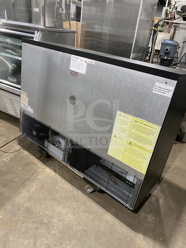 Vitlife VBBT-338H three-door glass swing door cooler, commercial black, chrome rack, on casters, with visible safety labels.