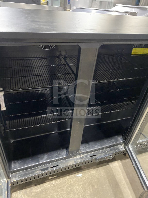Vitlife VBBT-338H commercial three-door glass swing door back bar cooler with chrome plated rack, on casters, in used condition.