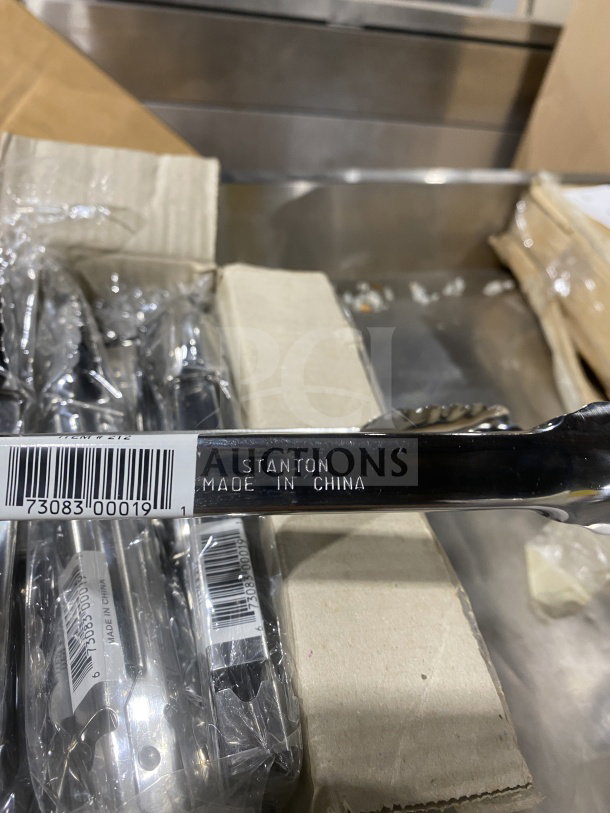 Stanton 9" stainless steel scalloped utility tongs, new in packaging, "Made in China" label, barcode visible.