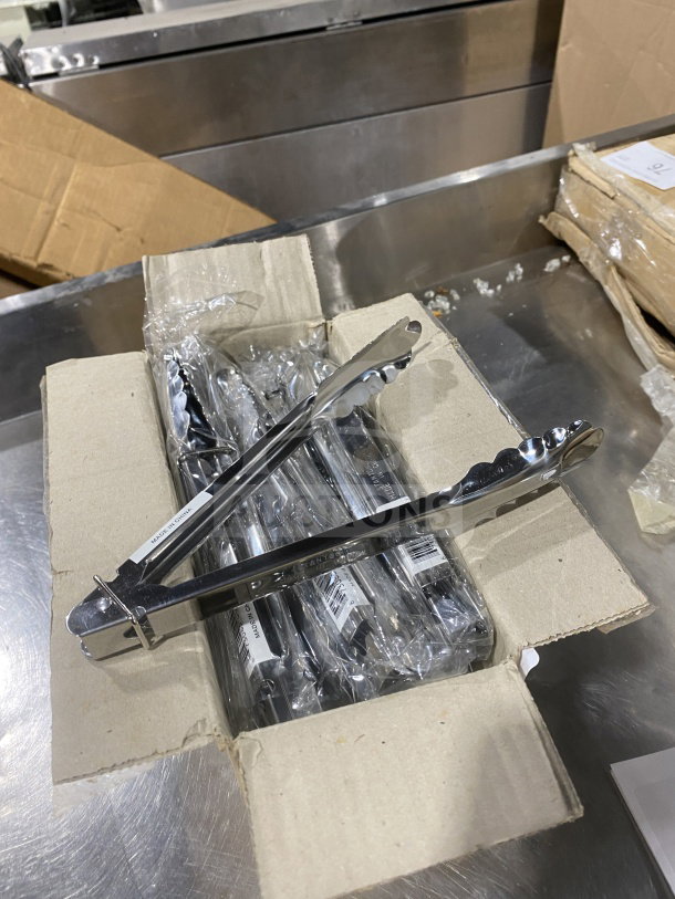 Stanton Commercial 9" stainless steel scalloped utility tongs in box, new condition, includes 12 tongs per bid.