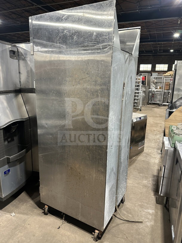 Continental 1FE-SA stainless steel single-door electric freezer on casters, poly-coated rack, 115V, SN: 15492787, used.