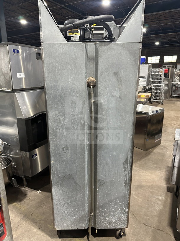 Continental stainless steel single-door freezer, Model 1FE-SA, SN: 15492787, 115V, on casters, shows surface wear.