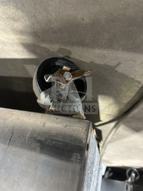 Continental 1FE-SA stainless steel freezer caster, shows rust, on casters. Item SN: 15492787, 115V, 1 Phase.