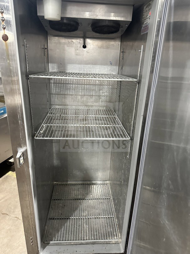 Continental stainless steel single-door electric freezer, model 1FE-SA, with poly-coated racks. On casters, working condition.