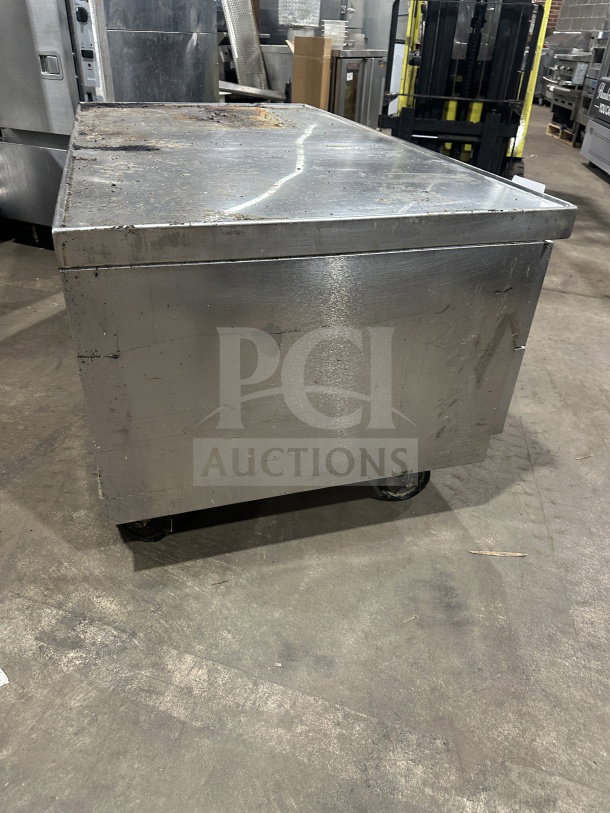 Beverage Air stainless steel fridge chef base, model WTRCS60-1, on casters. Visible wear, working when removed.