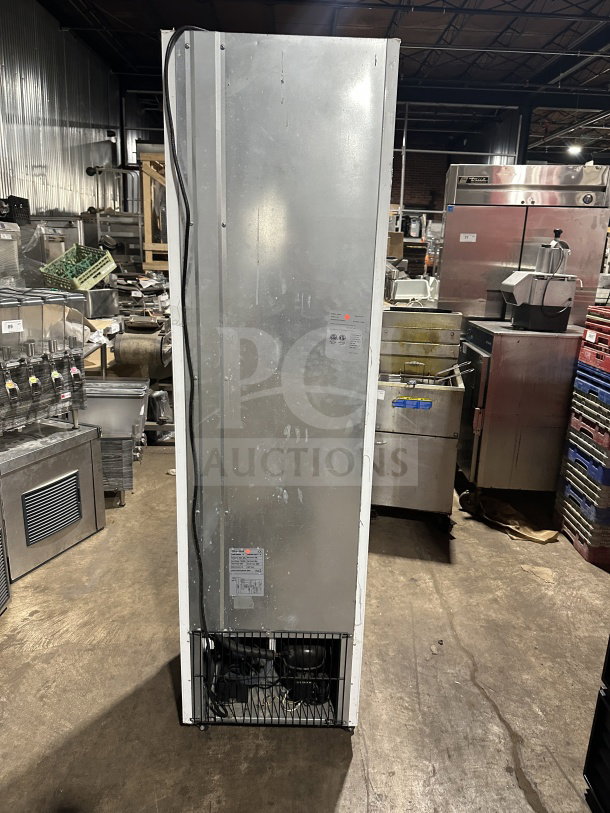 Commercial black gelato-style merchandiser freezer, single glass swing door, model SD240. Features door heater, LED light, poly-coated wire racks. Working condition.