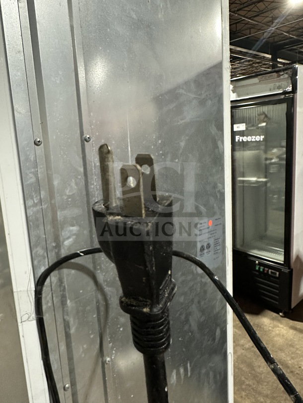 Commercial black gelato style merchandiser freezer, model SD240, with single glass swing door, door heater, LED light, poly coated wire racks.
