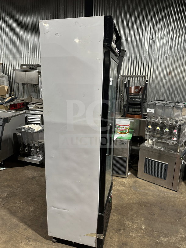 Commercial black gelato-style freezer, Model SD240, single glass swing door, door heater, LED light, poly-coated wire racks.