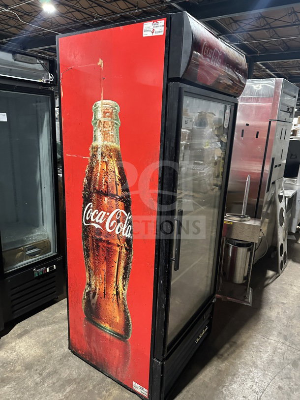 True Commercial Coca-Cola style black GDM-26EM merchandiser, single glass door, with poly coated rack, 115V, 1 phase.