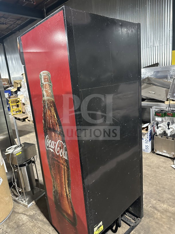 True Commercial Coca-Cola style black single glass-door merchandiser, Model GDM-26EM, with poly coated wire rack.
