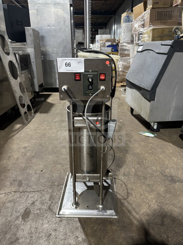 Commercial stainless steel electric sausage stuffer, working condition, features sturdy base and controls; item tag "66 QTY".