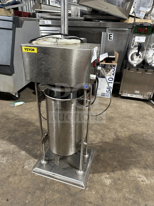 Commercial VEVOR stainless steel electric sausage stuffer, countertop meat filling machine, working condition, visible wiring.