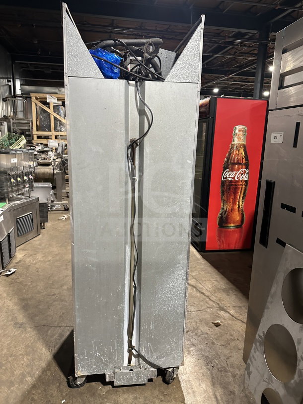 Continental 1F stainless steel reach-in freezer, single solid door, on casters, serial number 14340755, 115V, used condition.