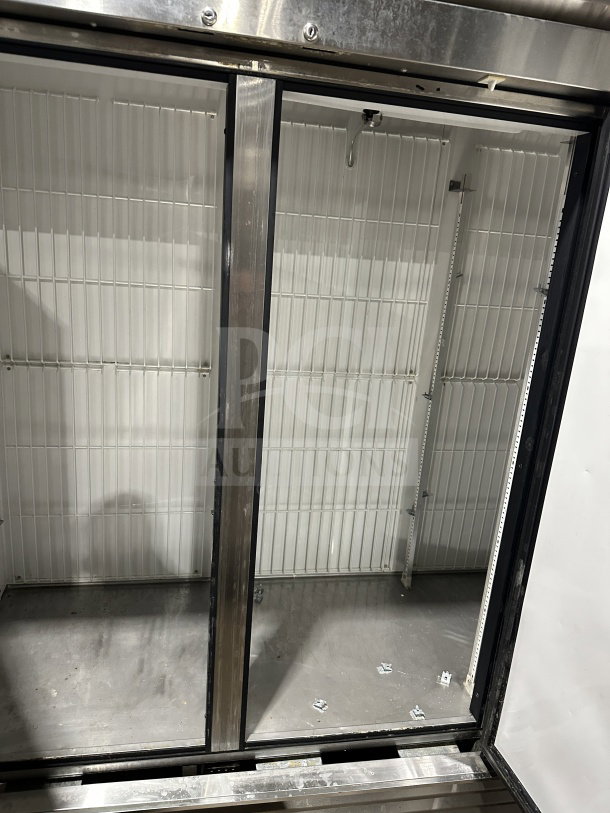 True T72-F stainless steel 3-door reach-in freezer, poly-coated rack, on casters, commercial quality, excellent condition.