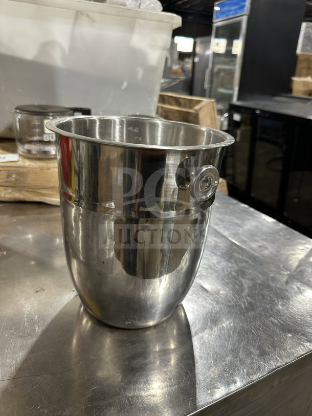Commercial stainless steel wine bucket, used for chilling champagne, with a polished finish, in good condition.