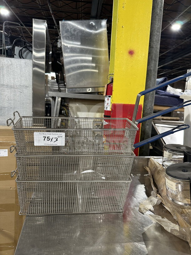 Commercial stainless steel deep fryer baskets with blue vinyl heat-resistant handles, set of three, excellent condition.
