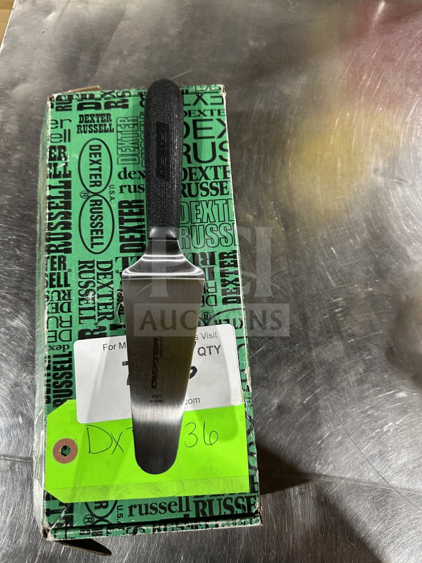 Dexter Russell S174 stainless steel offset spatula, black grip, new condition, on branded packaging with visible labels.