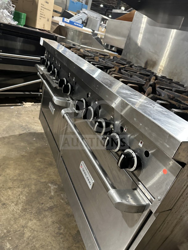 Garland stainless steel gas-powered 10-burner range with double oven, backsplash, wired oven rack; on legs, good condition.