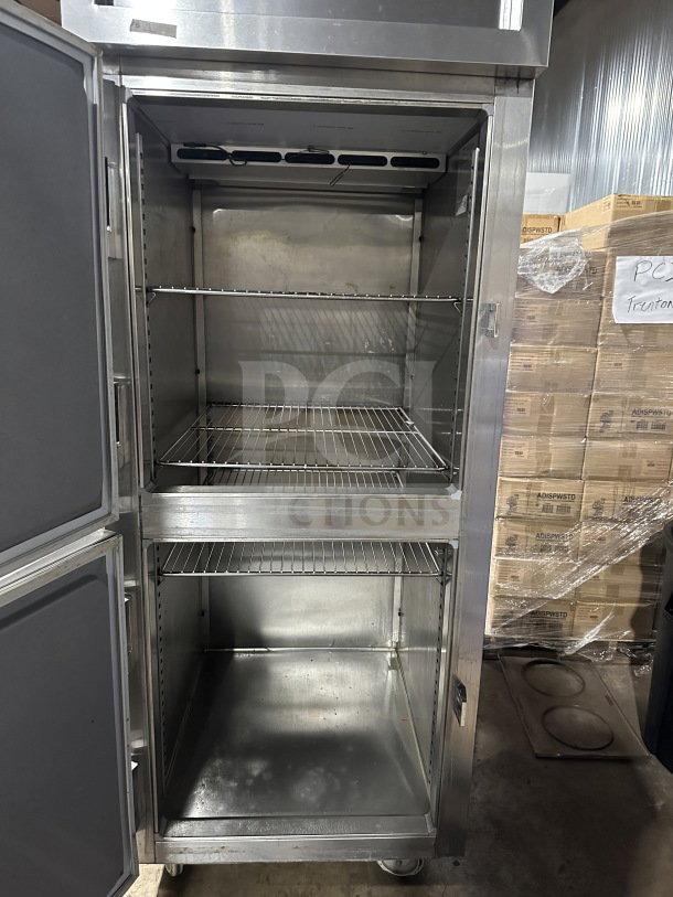 Delfield SSR1-SH13-21 stainless steel reach-in refrigerator, two-door compartments, 115V, on casters, commercial use.