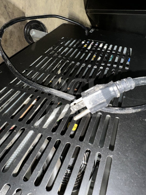 Power cord and vent panel of Avantco 178SS1FHC commercial stainless steel reach-in freezer; sturdy build, 115V, on casters.