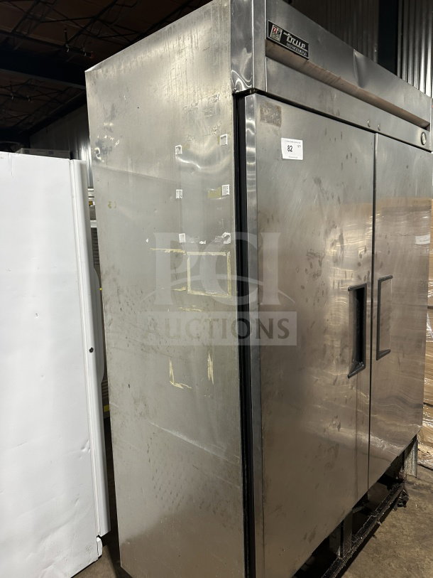 True T-49 commercial stainless steel 2-door refrigerator, Energy Star certified, with poly coated wired rack, on casters.