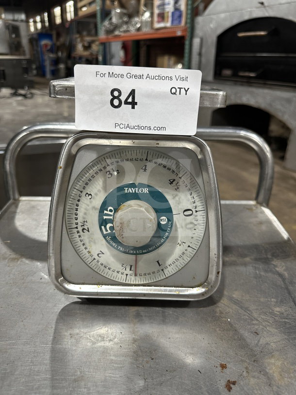 Taylor Commercial 5 lb. stainless steel food portioning scale, model 7855, featuring a clear dial. Used condition.