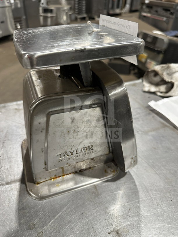 Taylor Commercial Stainless Steel 5 lb. Food Portioning Scale in used condition, featuring visible wear and Taylor branding.