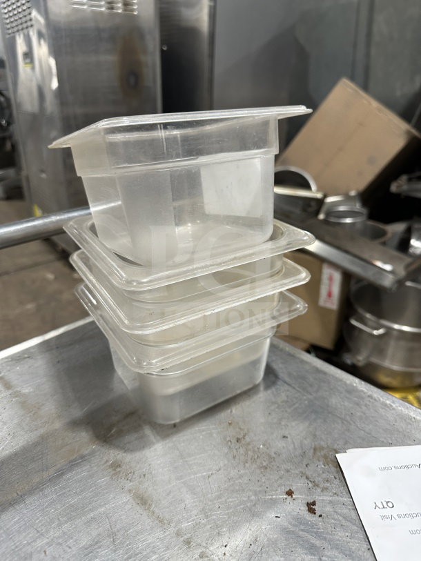Translucent Plus polypropylene food pans, full-size, stacked, slightly used, ideal for commercial kitchen storage.
