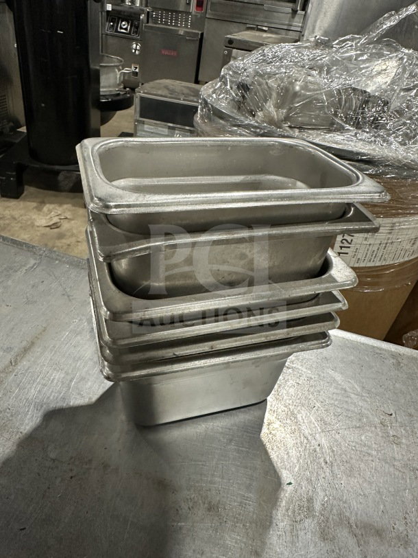 Den commercial stainless-steel food/sauce trays, stack of five, used condition, durable restaurant equipment.