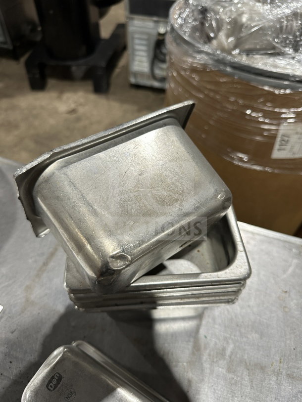 Den commercial stainless-steel food tray, stackable, durable. Slight wear, embossed Den logo. Ideal for professional kitchens.