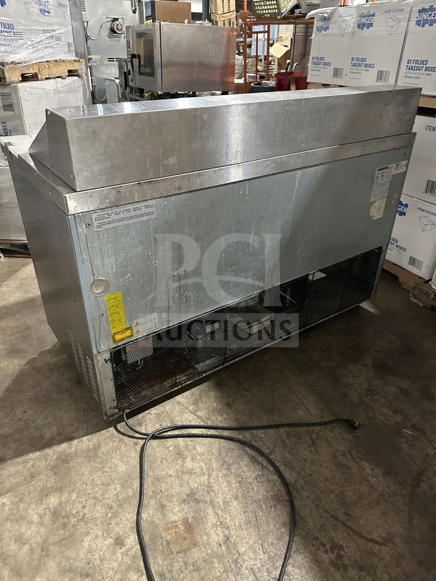 Maxx Cold MXCR60SHC commercial refrigerated prep table, stainless steel, two doors, poly coated rack, on casters.