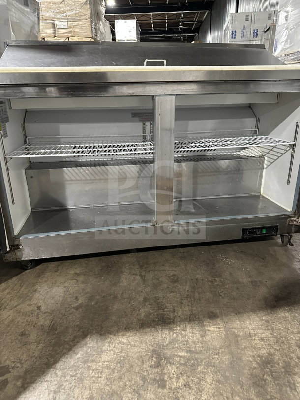 Maxx Cold MXCR60SHC stainless steel 2-door refrigerated prep table with poly-coated wired rack, on casters, in used condition.