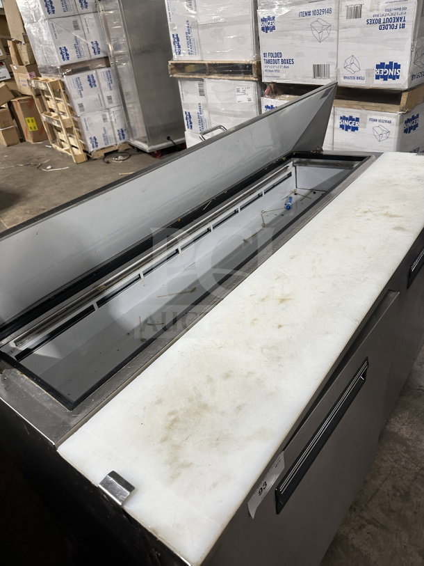 Maxx Cold MXCR60SHC stainless steel 2-door refrigerated prep table, bain marie style, with poly-coated rack on casters.