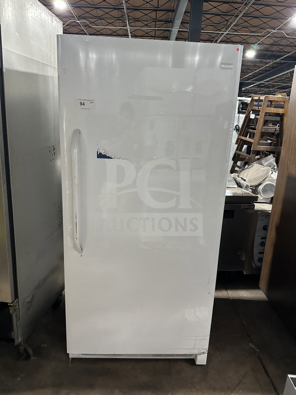 Frigidaire Electrolux commercial white upright freezer, model FFFH20F2QWC. Energy Star certified with poly coated wire rack.