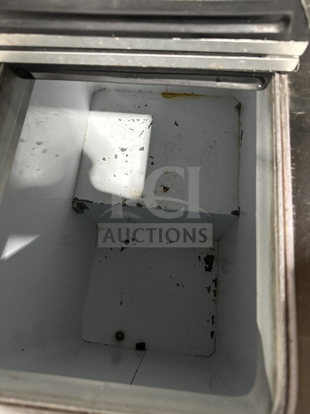 Global Commercial white electric ice cream dipping cabinet interior. Visible scratches and stains indicate used condition.