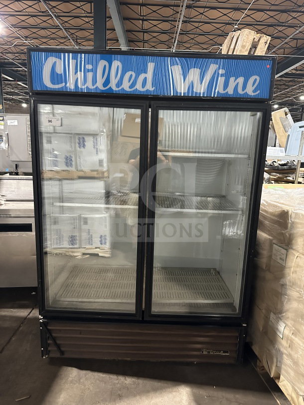 True Commercial Reach-In Double Glass Door Merchandiser Refrigerator, Model GDM-49, poly-coated racks, on casters, 115V, 1 phase.
