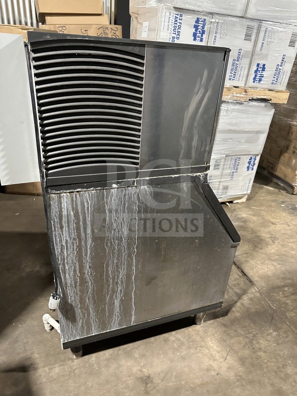 Manitowoc SY0304A ice maker, stainless steel, electric, air-cooled, 115V, 1 phase, on legs, visible wear on surface.