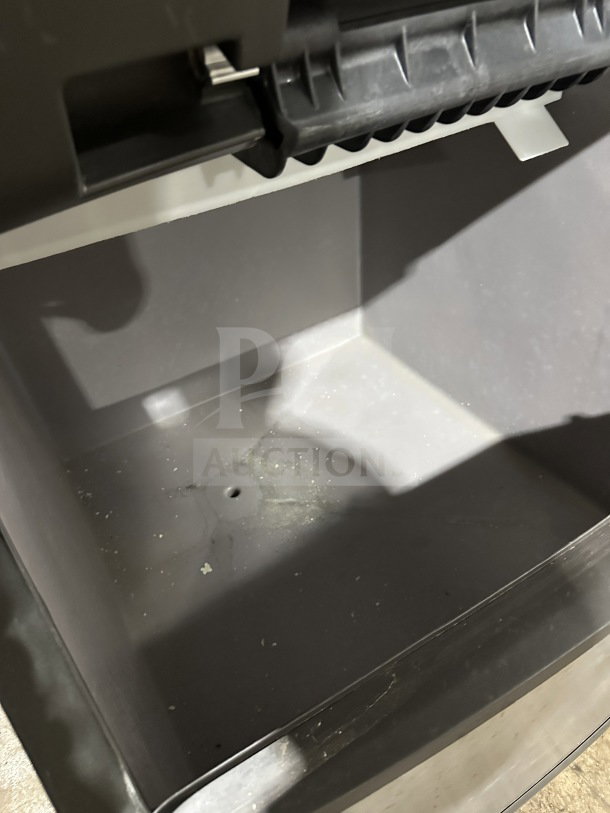 Manitowoc SY0304A ice maker, 115V, 1 phase, air-cooled, stainless steel, commercial-grade, on legs, clean interior.