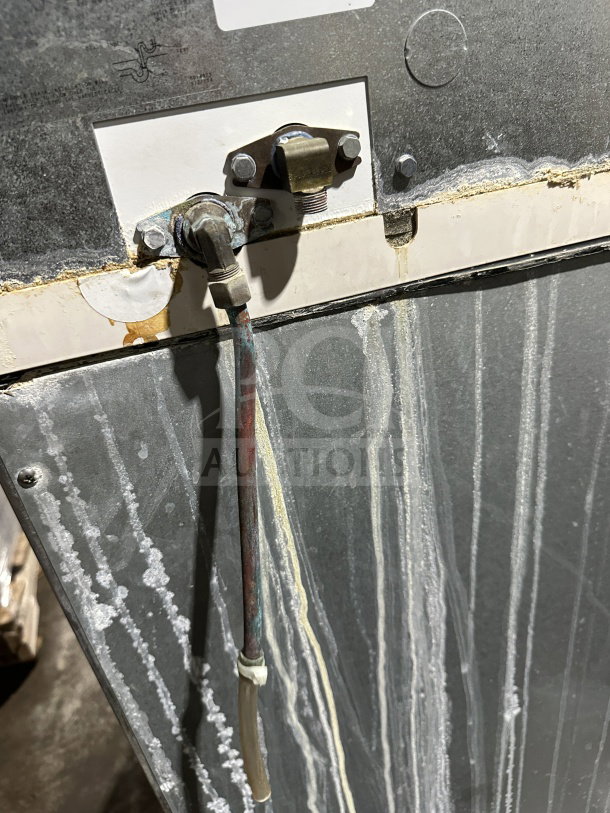 Manitowoc SY0304A ice making machine rear view with visible wiring and connectors. Signs of wear present.