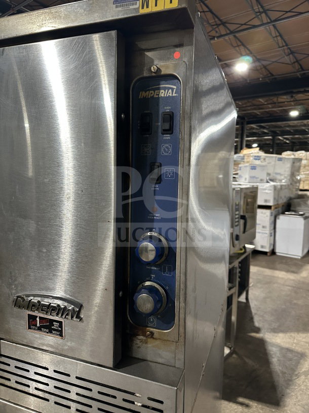 Imperial Commercial Stainless Steel Double Stacked Convection Oven, gas-powered, wired rack, on casters, visible control panel.