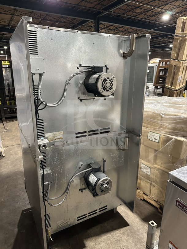 Imperial commercial double-stacked convection oven, gas-powered, stainless steel, with wired rack, on casters, auction item.