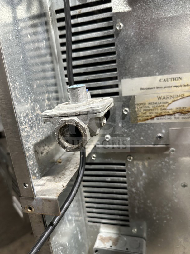 Rear panel of Imperial commercial stainless steel double stacked convection oven with wiring; caution and warning labels visible.