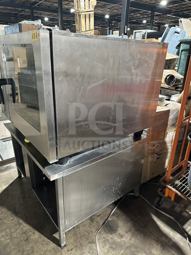 Rational SCC 62G combi oven, stainless steel, natural gas, double-stacked, wired racks, blue gas connector hose.