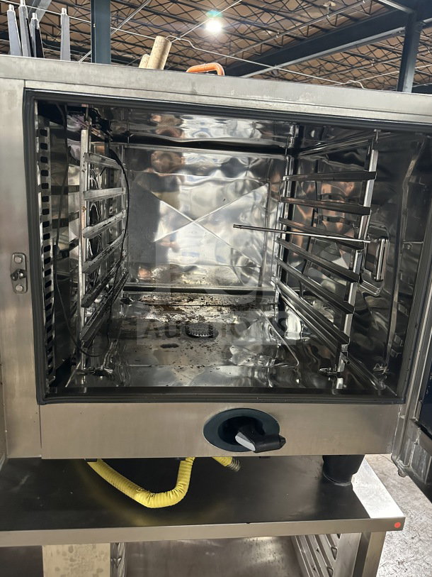 Rational SCC 62G double stacked stainless steel combi oven with wired racks, blue gas hose, model SCC 62G, natural gas powered.