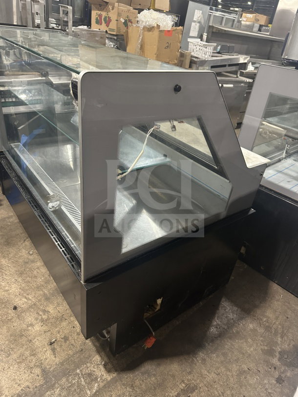 Senkar NETA4FT refrigerated bakery display case with black base and sliding door, clear glass structure, no compressor, 110V.